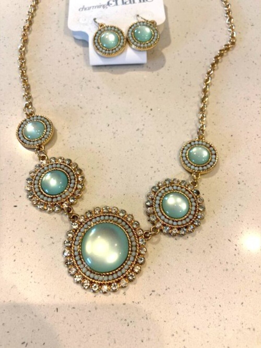 Charming Charlie Elegant Gold and light green Statement Necklace and earrings.